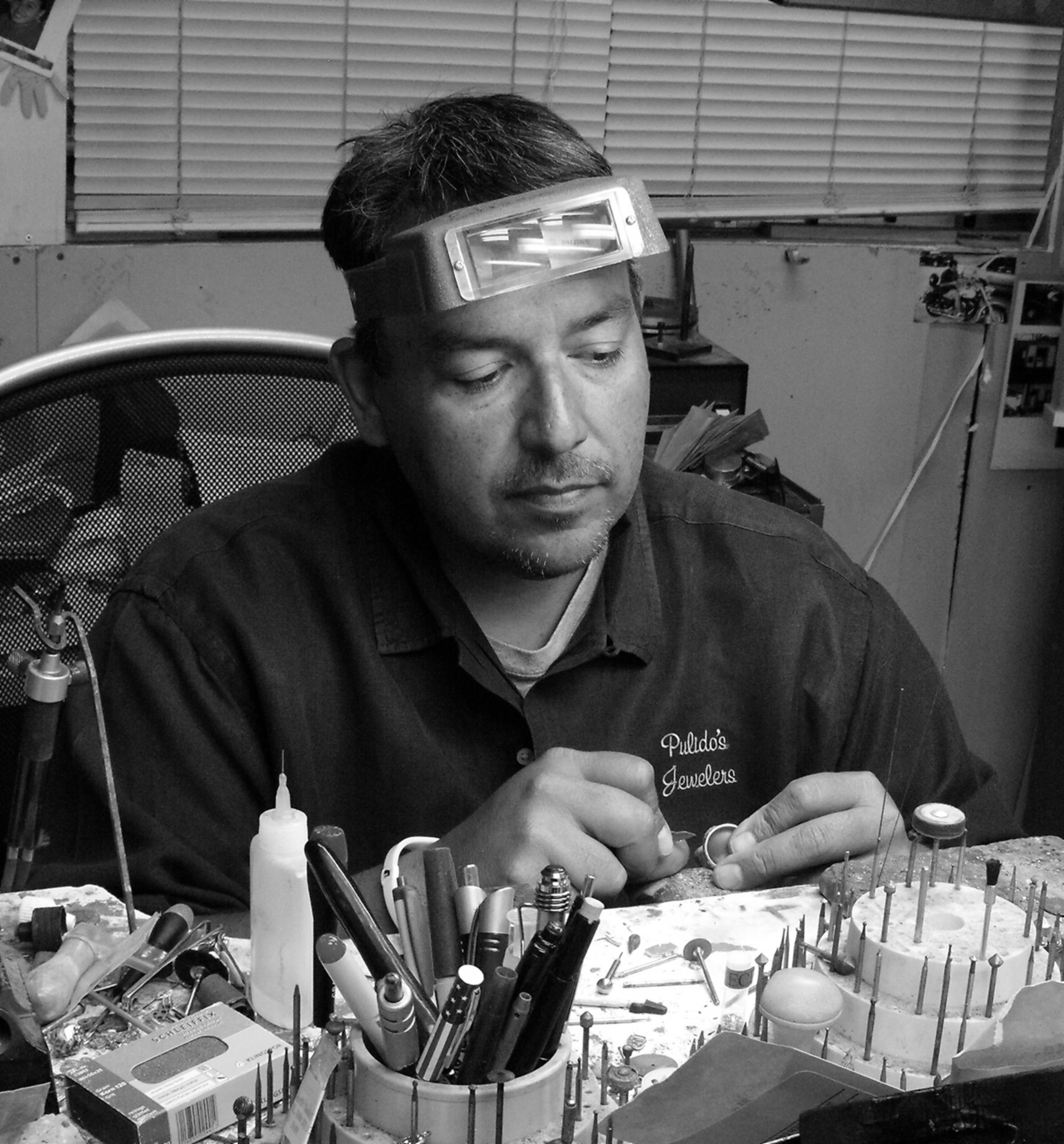 Eliseo working at his Jewelry work bench