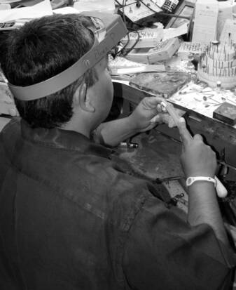 Eliseo Pulido working at his Jewelry work bench